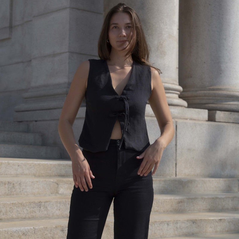 woman in black sleeveless tank vest and black pants