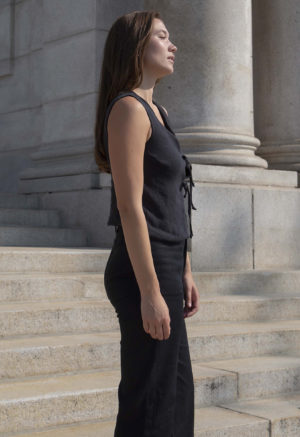 woman in black sleeveless tank vest and black pants