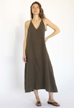 woman in dark green linen v-neck maxi swing dress