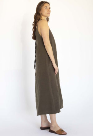 woman in dark green linen v-neck maxi swing dress