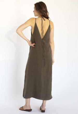 woman in dark green linen v-neck maxi swing dress