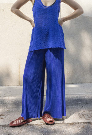 woman in blue wide-leg rib pants, matching long blue knit tank and maroon sandals