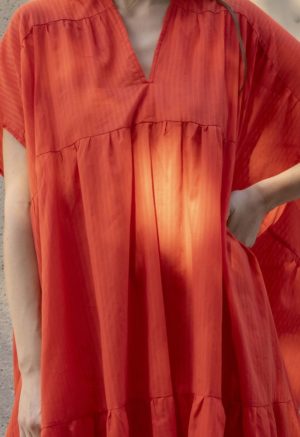 woman in bright red v-neck short sleeve tiered maxi dress