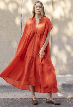 woman in bright red v-neck short sleeve tiered maxi dress