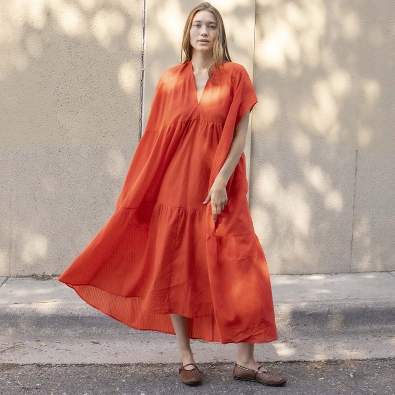 woman in bright red v-neck short sleeve tiered maxi dress