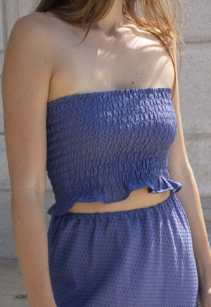 woman in hazy blue slip skirt and matching tube top