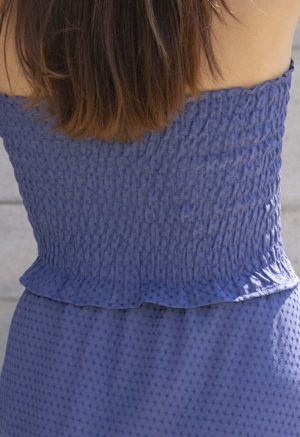 woman in hazy blue slip skirt and matching tube top