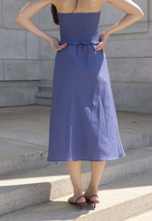 woman in hazy blue slip skirt and matching tube top