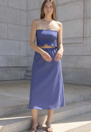 woman in hazy blue slip skirt and matching tube top