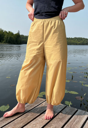 woman in tan/yellow wide-leg pant with balloon cuff