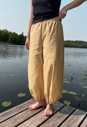 woman in tan/yellow wide-leg pant with balloon cuff