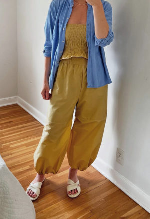 woman in tan/yellow wide-leg pant with balloon cuff