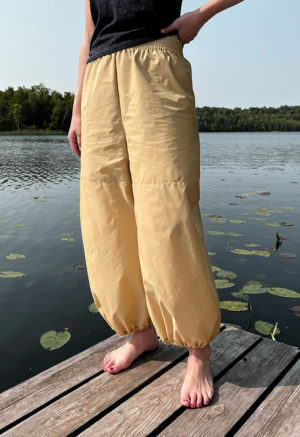 woman in tan/yellow wide-leg pant with balloon cuff