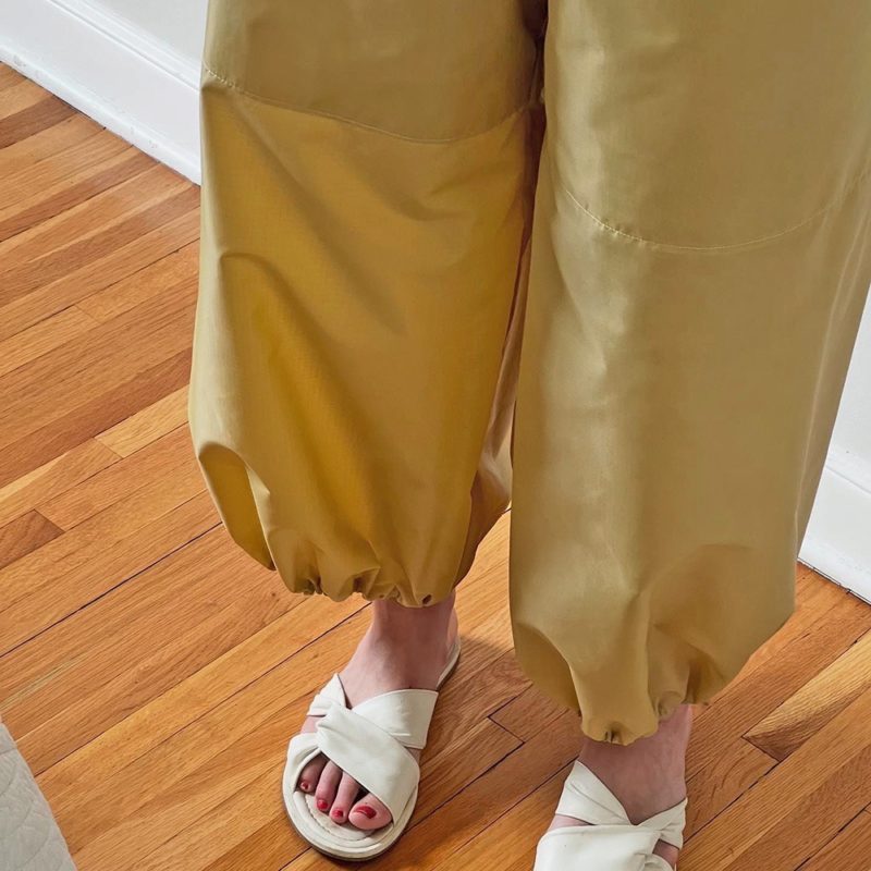 Wide Leg Balloon Pant woman in tan/yellow wide-leg pant with balloon cuff
