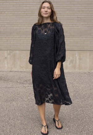 woman in black sheer floral dress