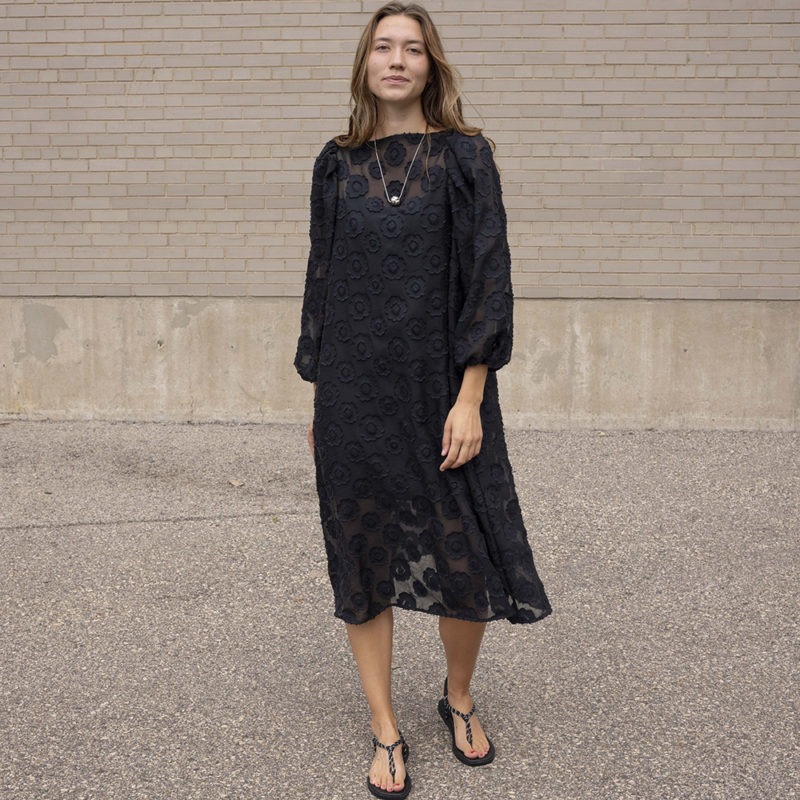 woman in black sheer floral dress