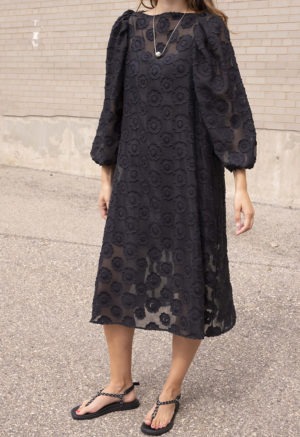woman in black sheer floral dress