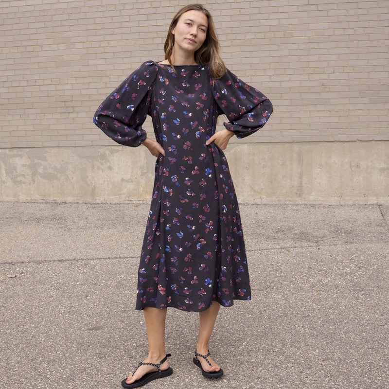 woman in black floral balloon sleeve midi dress