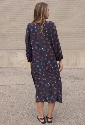 woman in black floral balloon sleeve midi dress
