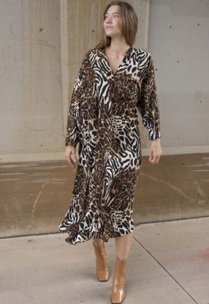 woman in cheetah print v-neck long sleeve midi dress