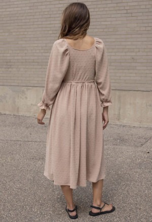 woman in blush wrap dress