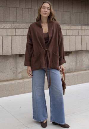 woman in brown oversized short jacket and jeans