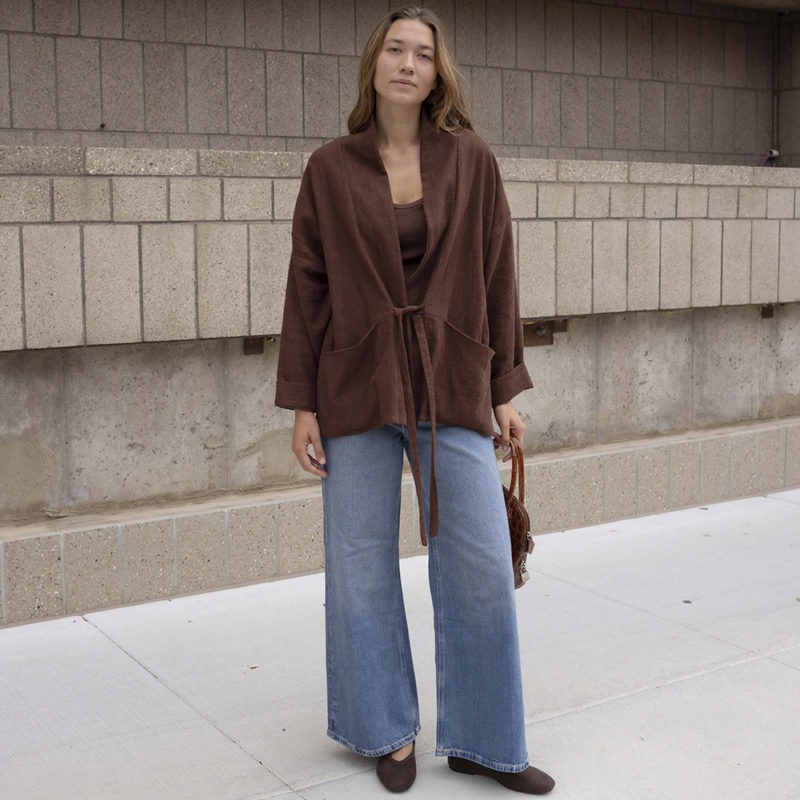 woman in brown oversized short jacket and jeans