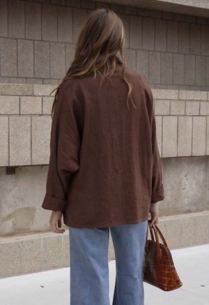 woman in brown oversized short jacket and jeans