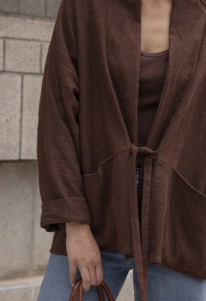 woman in brown oversized short jacket and jeans