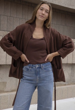 woman in brown oversized short jacket and jeans
