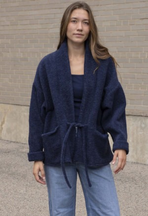 woman in navy blue wool jacket and jeans