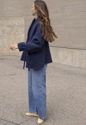 woman in navy blue wool jacket and jeans