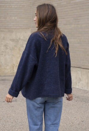 woman in navy blue wool jacket and jeans