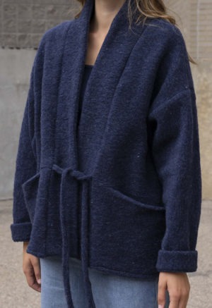 woman in navy blue wool jacket and jeans