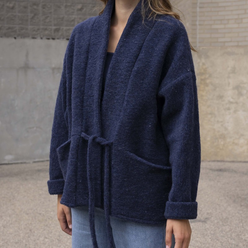 woman in navy blue wool jacket and jeans