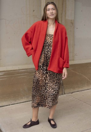 woman in red jacket, leopard print dress
