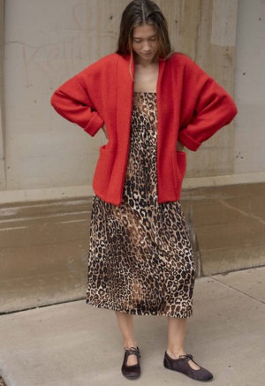 woman in red jacket, leopard print dress