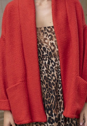 woman in red jacket, leopard print dress