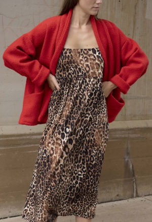 woman in red jacket, leopard print dress