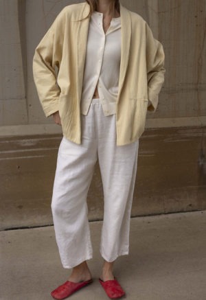 Short jacket with front seamless pockets. Straight line hem.  Oversized fit.