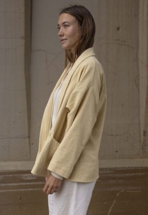 Short jacket with front seamless pockets. Straight line hem.  Oversized fit.