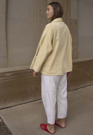 Short jacket with front seamless pockets. Straight line hem.  Oversized fit.