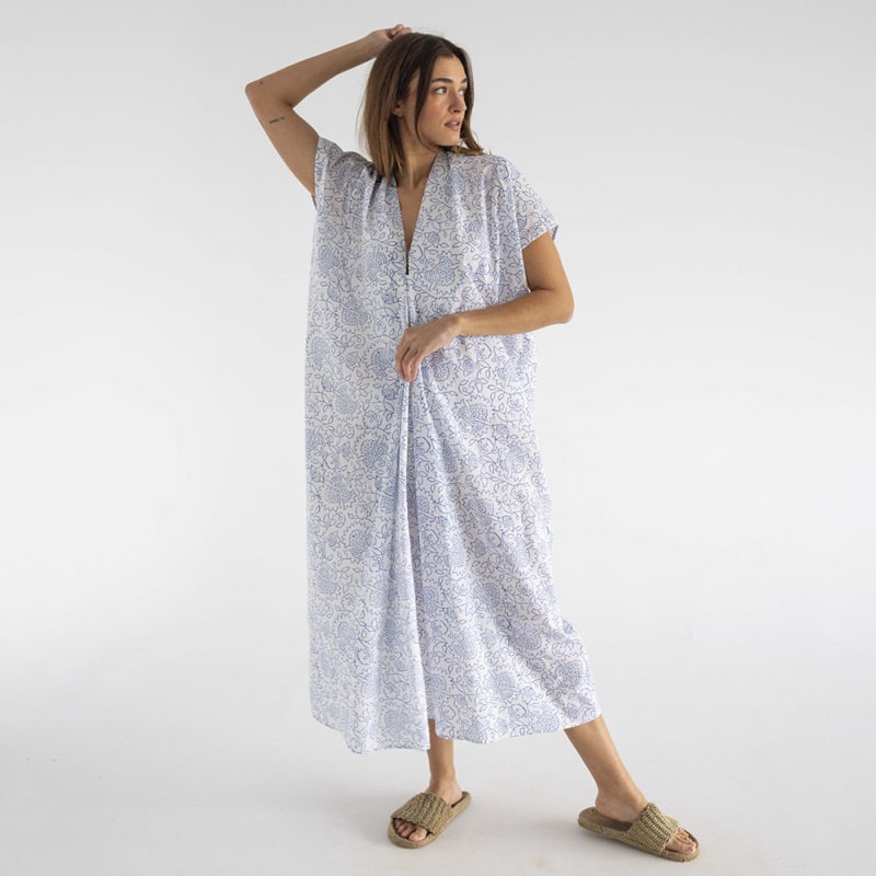 woman in midi length white cotton kaftan