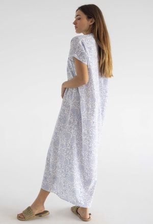 woman in midi length white cotton kaftan