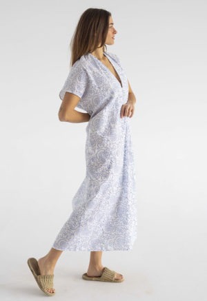 woman in midi length white cotton kaftan