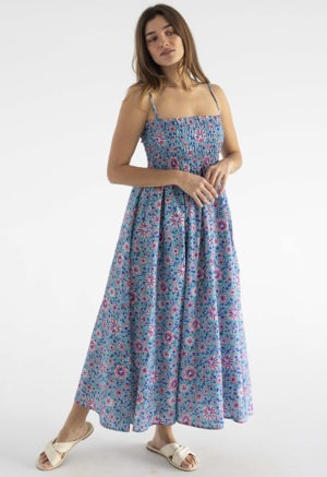 woman in teal floral ruched sundress with spaghetti straps