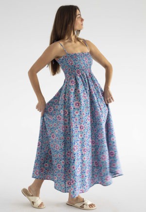 woman in teal floral ruched sundress with spaghetti straps