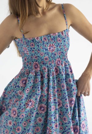 woman in teal floral ruched sundress with spaghetti straps