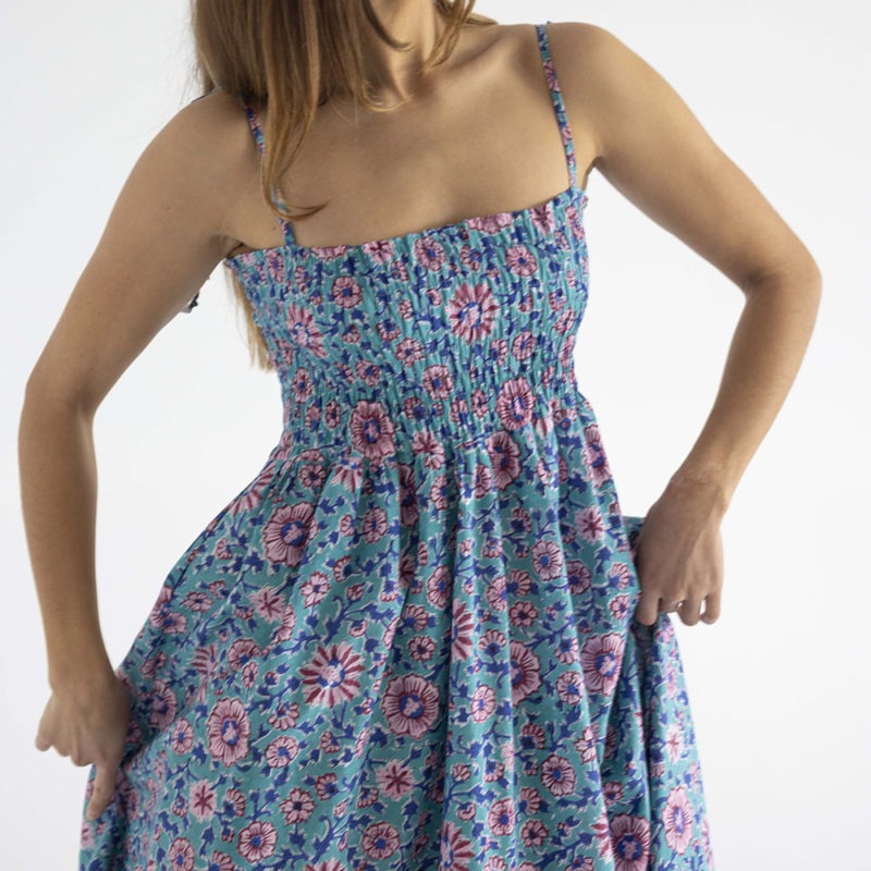 woman in teal floral ruched sundress with spaghetti straps