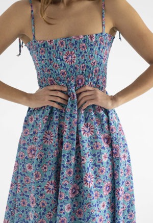 woman in teal floral ruched sundress with spaghetti straps